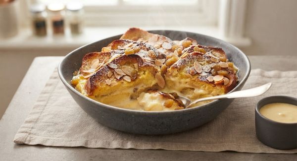 How do you achieve the ideal texture for a creamy bread and butter pudding?